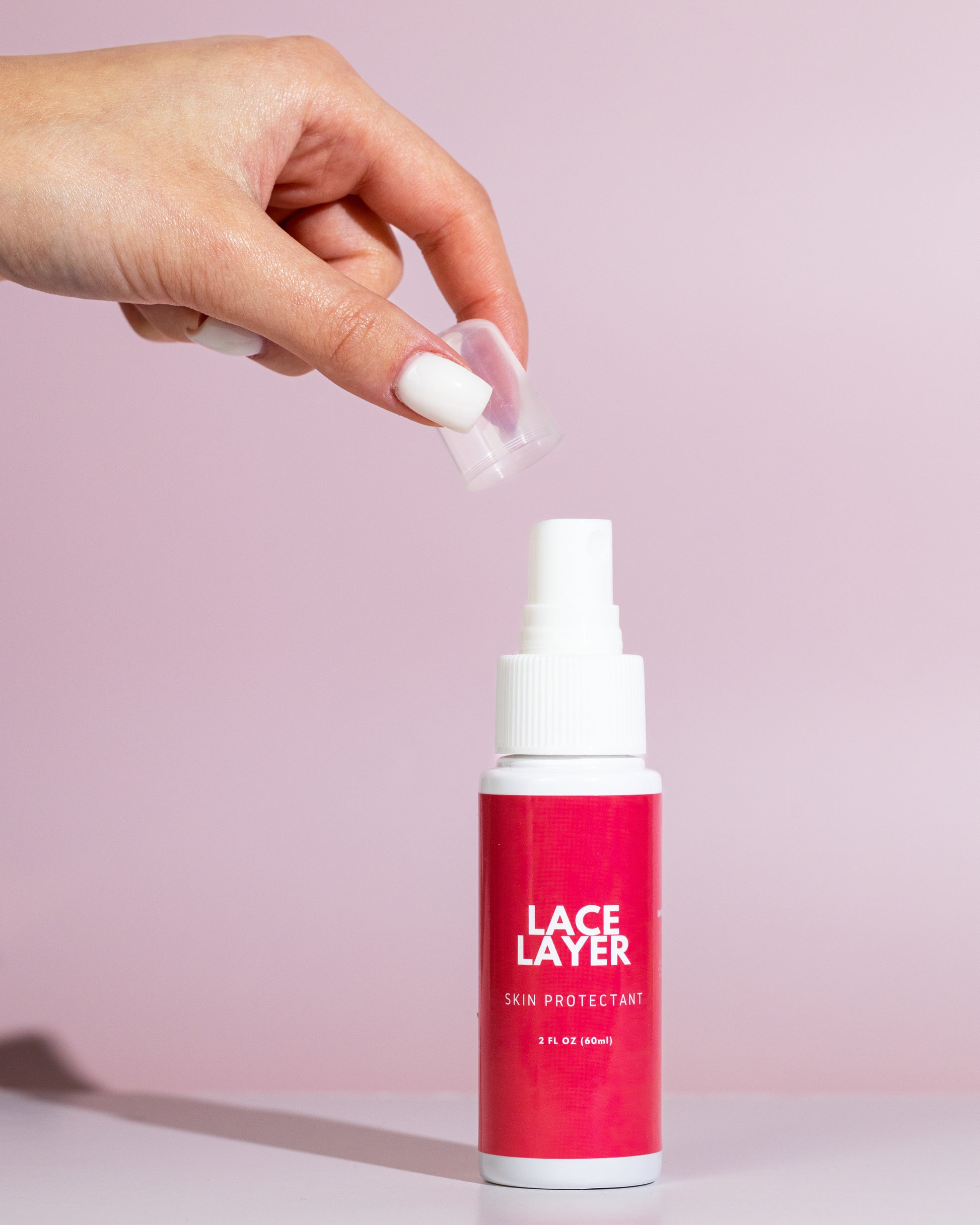 Women taking cap of lace layer skin protectant